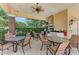 Covered grilling and dining area with multiple tables and chairs at 12715 Lake Silver Ave, Bradenton, FL 34211