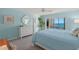 Main bedroom with ocean view and white furniture at 550 Flamingo Dr # 202, Venice, FL 34285