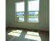 Sun-filled bedroom with water views showcasing bright light at 705 Anegada Ln, Sarasota, FL 34234