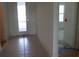 Hallway with a door leading to the outside and another doorway to another room at 705 Anegada Ln, Sarasota, FL 34234
