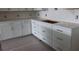 Close up of the new white kitchen cabinets with modern stainless steel pulls at 705 Anegada Ln, Sarasota, FL 34234