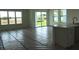 Bright living room featuring large windows, sliding glass doors and view of the backyard at 705 Anegada Ln, Sarasota, FL 34234