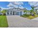 Beautiful two-story home boasts lush landscaping, a paver driveway and a three-car garage at 8175 Redonda Loop, Lakewood Ranch, FL 34202