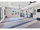 Fitness center featuring modern exercise equipment, fans and ample windows at 8175 Redonda Loop, Lakewood Ranch, FL 34202