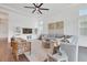 Comfortable living room featuring neutral colors and an entertainment center at 8175 Redonda Loop, Lakewood Ranch, FL 34202
