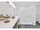 Modern bathroom with glass-enclosed shower, dual vanity, and sleek design at 8175 Redonda Loop, Lakewood Ranch, FL 34202