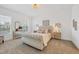 Well-lit main bedroom features a tufted headboard and neutral accents at 8175 Redonda Loop, Lakewood Ranch, FL 34202