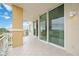 Spacious balcony with sliding glass doors and outdoor access at 130 Riviera Dunes Way # 306, Palmetto, FL 34221