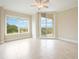 Bright bedroom with tile floor and balcony access at 130 Riviera Dunes Way # 306, Palmetto, FL 34221