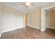 Bright bedroom with wood-look floors and spacious closet at 130 Riviera Dunes Way # 306, Palmetto, FL 34221