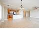 Open concept dining area with kitchen access at 130 Riviera Dunes Way # 306, Palmetto, FL 34221