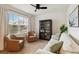 Cozy sitting area featuring comfortable seating and a stylish glass cabinet at 17124 Harvest Moon Way, Lakewood Ranch, FL 34211