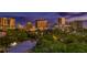 City skyline view at sunset, trees in foreground at 235 Cocoanut Ave # 113C, Sarasota, FL 34236
