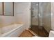 Luxurious bathroom with soaking tub and walk-in shower at 235 Cocoanut Ave # 113C, Sarasota, FL 34236