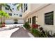 Townhouse with front door and parking area at 235 Cocoanut Ave # 113C, Sarasota, FL 34236