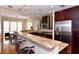 Modern kitchen with dark wood cabinets, granite countertops, and stainless steel appliances at 235 Cocoanut Ave # 113C, Sarasota, FL 34236