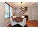 Dining room with hardwood floors, modern chandelier and staircase at 235 Cocoanut Ave # 113C, Sarasota, FL 34236