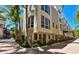 Modern townhouse with a private entrance and lush landscaping at 235 Cocoanut Ave # 113C, Sarasota, FL 34236