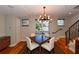 Dining room with hardwood floors, modern chandelier and staircase at 235 Cocoanut Ave # 113C, Sarasota, FL 34236