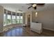Bright living room with bay windows and hardwood floors at 235 Cocoanut Ave # 113C, Sarasota, FL 34236