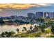 Scenic aerial view of a waterfront community at sunset, with boats and high-rise buildings at 235 Cocoanut Ave # 113C, Sarasota, FL 34236