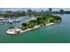 Aerial view of a lush green island in the water at 235 Cocoanut Ave # 113C, Sarasota, FL 34236
