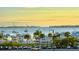 Sunset view of marina, boats, and parking lot at 235 Cocoanut Ave # 113C, Sarasota, FL 34236