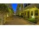 Evening view of building with landscaped walkway at 235 Cocoanut Ave # 113C, Sarasota, FL 34236