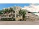 Modern building exterior, featuring a clean design and palm trees at 235 Cocoanut Ave # 113C, Sarasota, FL 34236