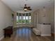 Bright living room with bay windows and hardwood floors at 235 Cocoanut Ave # 113C, Sarasota, FL 34236