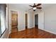 Hardwood floor bedroom with access to bathroom at 235 Cocoanut Ave # 113C, Sarasota, FL 34236