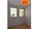 Bright room with tiled floor and two windows at 235 Cocoanut Ave # 113C, Sarasota, FL 34236