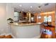 Modern kitchen with a curved granite island and stainless steel appliances at 235 Cocoanut Ave # 113C, Sarasota, FL 34236