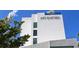 Modern white hotel building with rooftop terrace at 235 Cocoanut Ave # 113C, Sarasota, FL 34236
