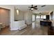 Open living room with hardwood floors and access to kitchen at 235 Cocoanut Ave # 113C, Sarasota, FL 34236