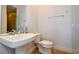 Clean bathroom with single vanity and toilet at 235 Cocoanut Ave # 113C, Sarasota, FL 34236