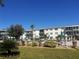 Community pool with lounge chairs and a grassy area at 1837 Flamingo Blvd # O35, Bradenton, FL 34207