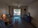 Living room with sofa, coffee table and access to a balcony at 1837 Flamingo Blvd # O35, Bradenton, FL 34207