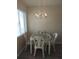 Bright dining area with glass-top table and chairs at 1837 Flamingo Blvd # O35, Bradenton, FL 34207