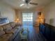 Living room with sofa, coffee table and access to a balcony at 1837 Flamingo Blvd # O35, Bradenton, FL 34207