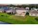 Aerial view of house and backyard with lake at 15436 Trinity Fall Way, Bradenton, FL 34212