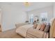 Spacious bedroom with a comfortable bed and plenty of natural light at 8175 Redonda Loop, Lakewood Ranch, FL 34202