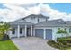 Two-story house with gray roof and double car garage at 8175 Redonda Loop, Lakewood Ranch, FL 34202