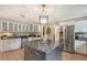 Kitchen with granite countertops, custom cabinetry, and island at 1585 South Dr, Sarasota, FL 34239