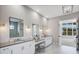 Elegant bathroom with double vanity and marble floors at 16518 Cornwall Ln, Bradenton, FL 34202