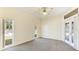 Spacious bedroom with carpet flooring and French doors at 2818 48Th E Way, Bradenton, FL 34203