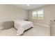 Comfortable bedroom with a queen-size bed, double dresser and large window at 4133 Golden Creek Ter, Parrish, FL 34219
