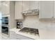 Modern kitchen features with stainless steel appliances and marble backsplash at 4133 Golden Creek Ter, Parrish, FL 34219