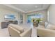 Spacious living area featuring a large TV, comfortable seating, and access to other rooms at 4133 Golden Creek Ter, Parrish, FL 34219