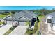 Aerial view of two-unit home with a pond nearby at 4133 Golden Creek Ter, Parrish, FL 34219